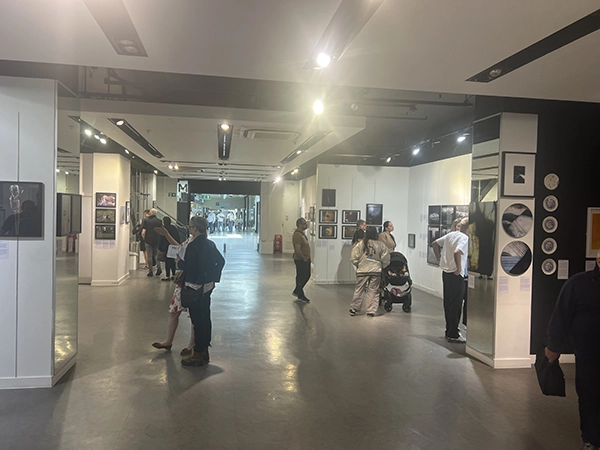 Atmospheric view of visitors exploring photography exhibits during the Chester Photo Festival 1st Edition.